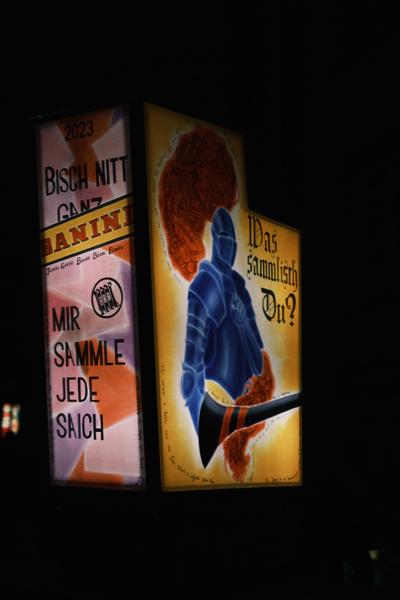 Nighttime Illuminated Poster Panels with Blue Armor Figure Basel, Switzerland