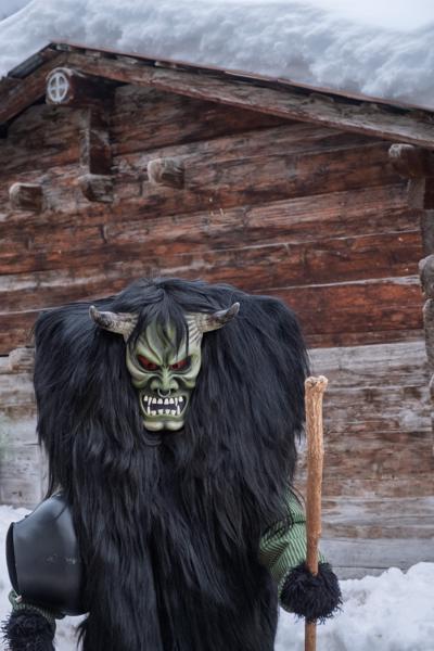 Tschäggättä Carnival Mask Figure in Snowy Alpine Village, Valais Wiler (Lötschen), Switzerland