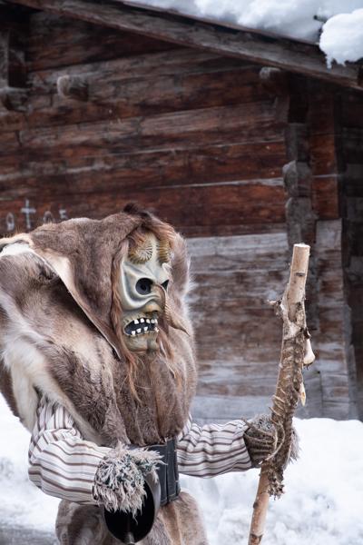 Tschäggättä Carnival Figure in Snowy Alpine Village, Lötschental (Switzerland) Wiler (Lötschen), Switzerland