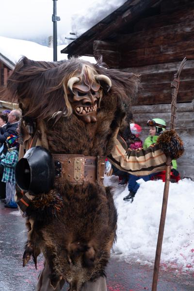 Tschäggättä Masked Figure at a Snowy Alpine Carnival (Lötschental, Valais) Wiler (Lötschen), Switzerland