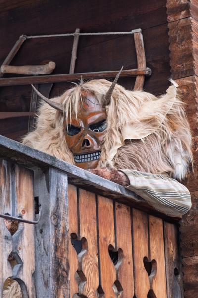 Tschäggättä Carnival Mask on a Wooden Chalet Balcony, Valais (Switzerland) Wiler (Lötschen), Switzerland