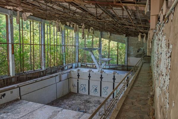 Abandoned indoor swimming pool shrouded in decay Prypiat, Ukraine