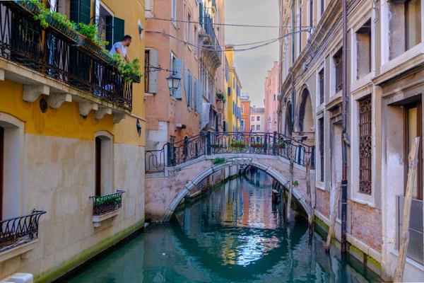 Colorful Venetian Canal with Arch Bridge Venice, Italy